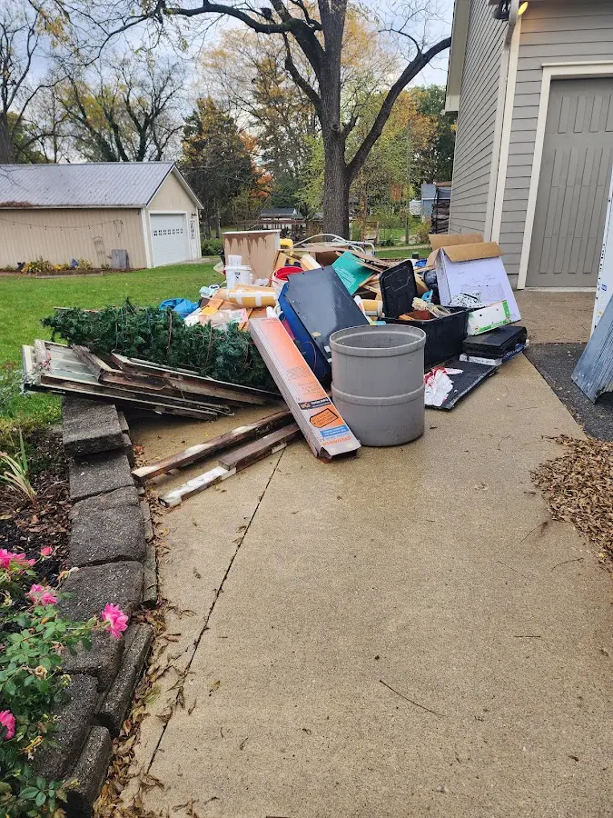 Dumpster being loaded with debris for 10 Yard Dumpster Rental in Roanoke